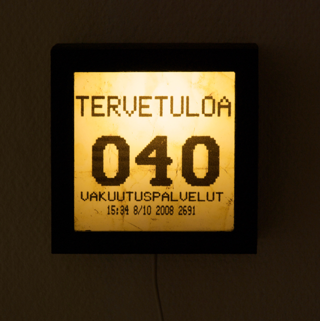 Self portrait as a waiting number<br>(lightbox,<br>15cm x 15cm x10cm)<br>Finnish Academy of Fine Arts Collection